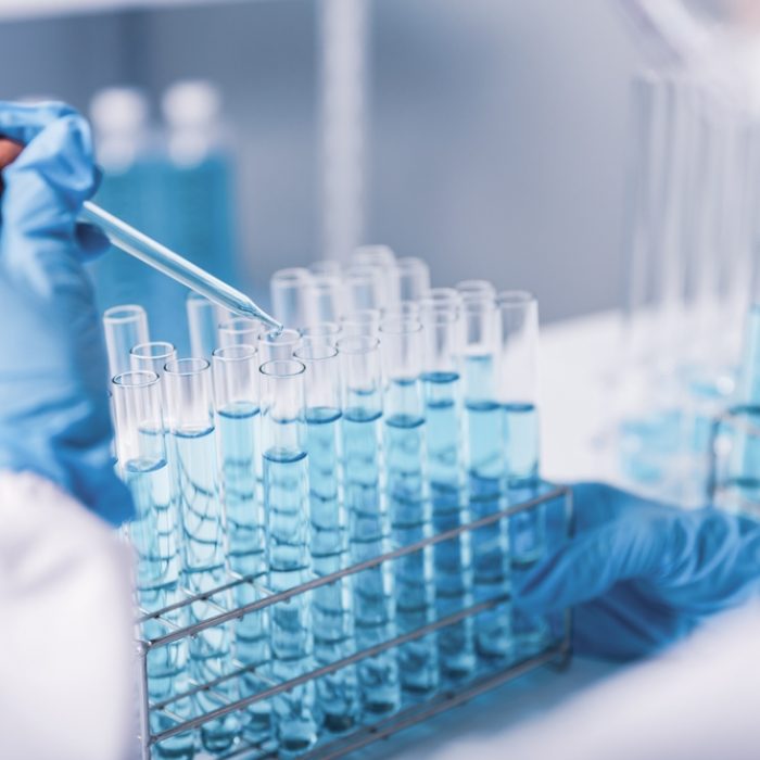 Chemist,scientist,Hand,Dropping,Chemical,Liquid,Into,Test,Tube,,Science,Research